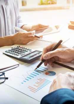 business man financial inspector and secretary making report, ca business man financial inspector and secretary making report, calculating or checking balance. Internal Revenue Service inspector checking document. Audit concept